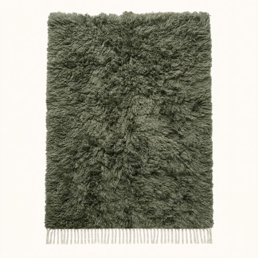 Sage green and ivory Beni Ourain rug Talwit with undyed shag texture, flat lay on plain background