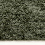 Close-up of sage green and ivory pile texture on Beni Ourain rug Talwit showing thick wool construction