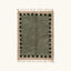 Full view of the Ifru sage green, forest green and ivory Beni Ourain rug with a block border design.