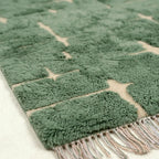 Sage green and ivory Mrirt rug Aseggas edge detail