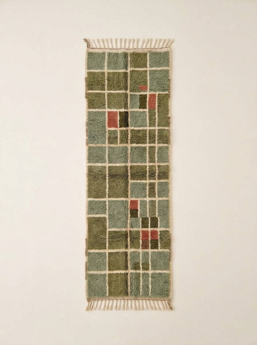 Sage green and olive Mrirt runner with grid check pattern and cream lines, showing accent blocks of pink, mustard and charcoal – Tafat