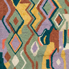 Pattern detail of Tafrar showing outlined diamonds, zigzags and small abstract shapes