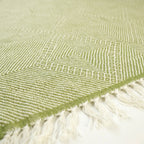 Sage green and ivory Zanafi kilim rug Akalun with minimal linear grid, flat-weave texture detail