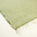 Sage green and ivory Zanafi kilim rug Akalun with minimal linear grid, edge and fringe detail