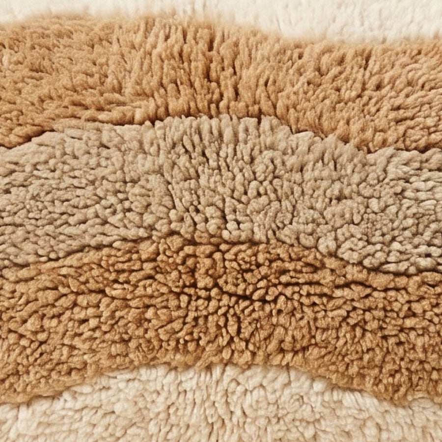 Close-up of the desert stripes pattern on the Tinariwen Moroccan wool pillow