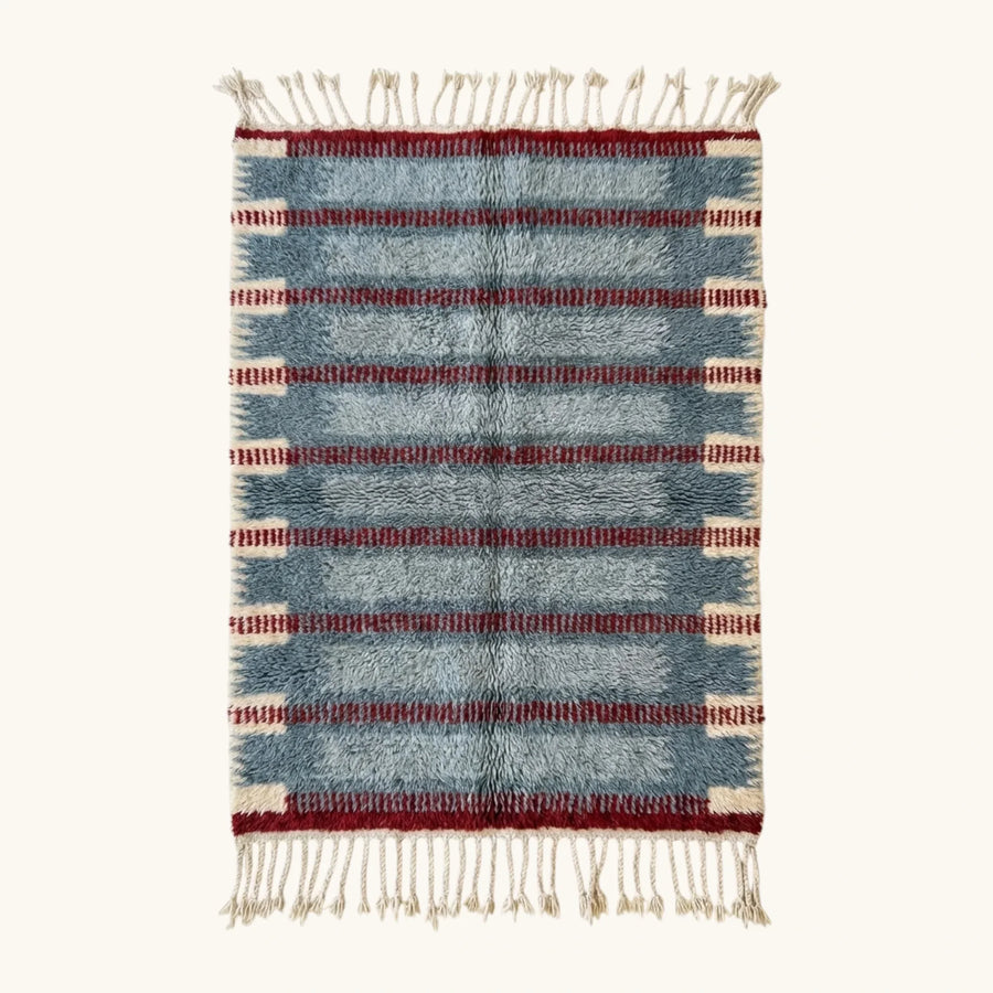 Full view of the Izen slate blue, burgundy and ivory Beni Ourain rug with a horizontal band design.