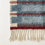 Close-up of the natural Atlas wool texture on the Izen rug.