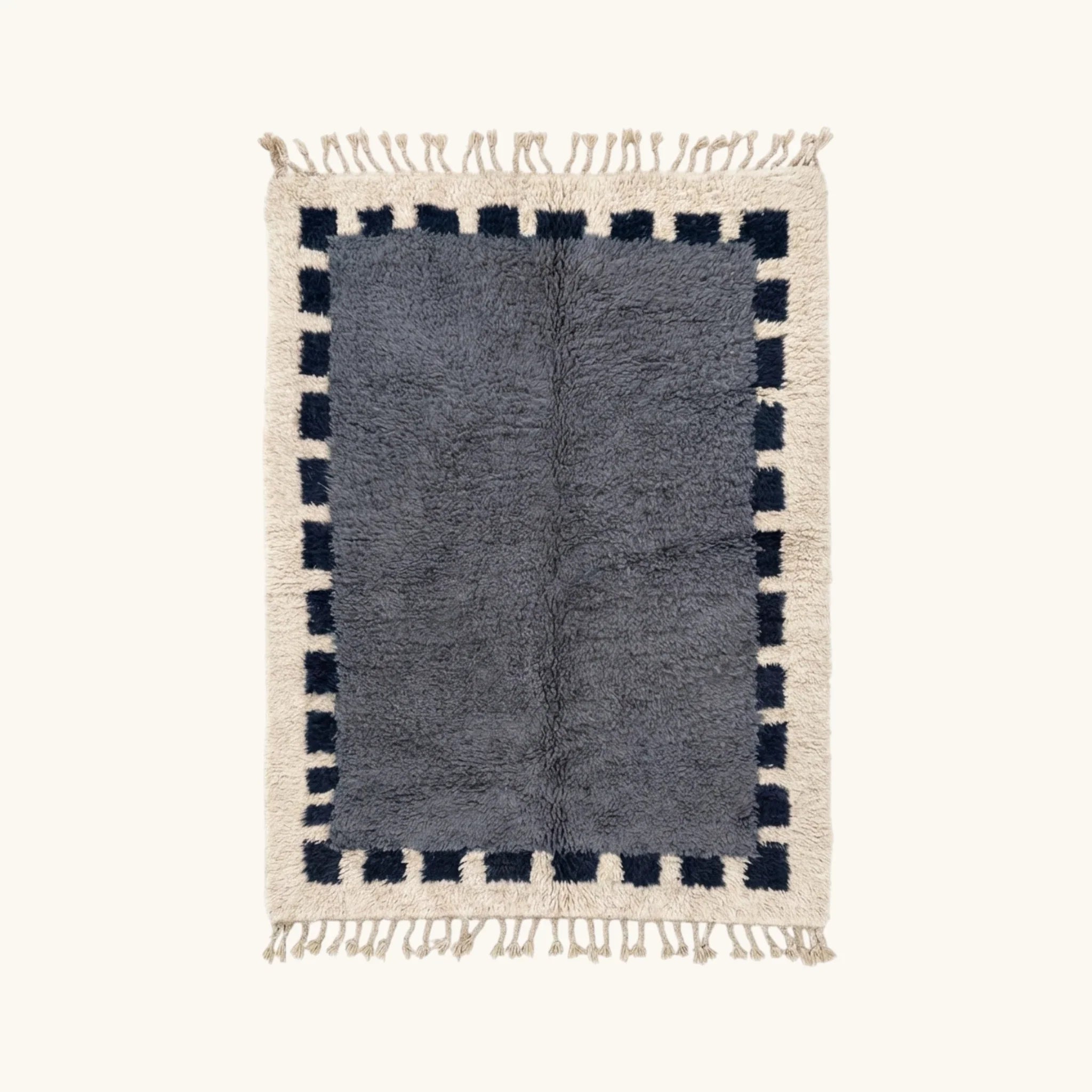 Full view of the Tamesna slate blue, navy and ivory Beni Ourain rug with a block border design.