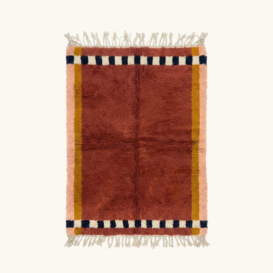 Tafukt terracotta Beni Ourain rug with checkered border motif, full view