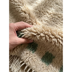 Hand-tied fringe and plush ivory Atlas wool detail of the Tala rug.
