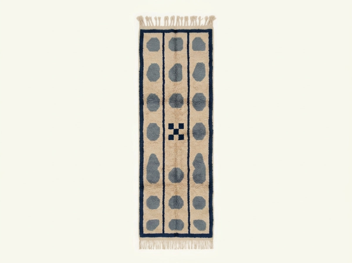 Flat lay of Tan, Slate Blue & Navy Mrirt runner showing three columns of slate blue pebbles separated by navy stripes with center cross-hatch motif