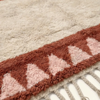Tanirt blush Beni Ourain rug triangle border and fringe detail
