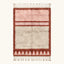 Full view of the Tanirt blush Beni Ourain rug with a framed triangle motif and hand-tied fringe.