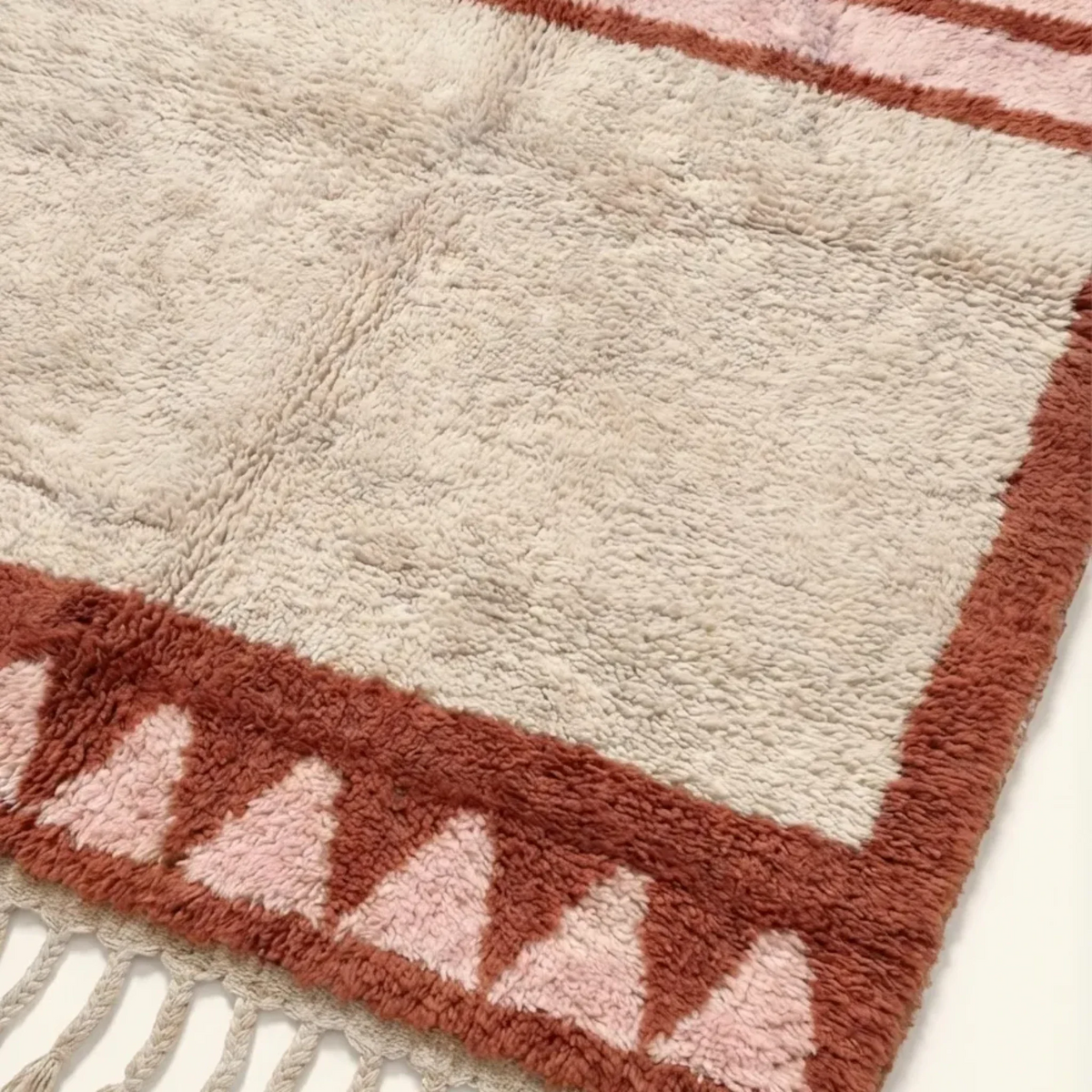 Tanirt blush Beni Ourain rug framed triangle motif detail