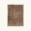 Full view of the Targa taupe Beni Ourain rug with small ivory cross motifs.