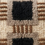 Close-up of the ticked grid pattern on the Tifinagh Moroccan wool pillow