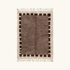 Full view of the Awrir taupe, brown and ivory Beni Ourain rug with a block border design.