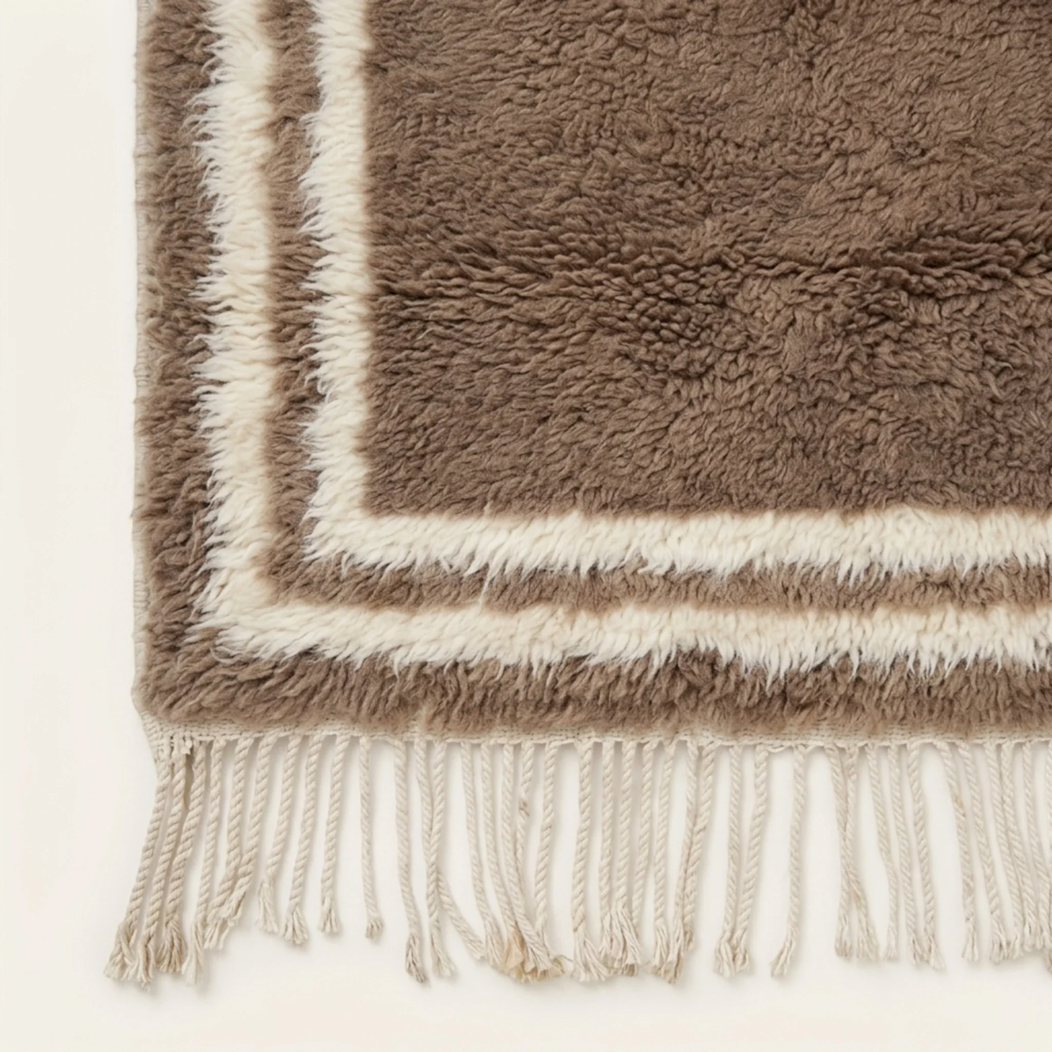 End view of the Ayyur Beni Ourain rug with its taupe field and ivory double border.