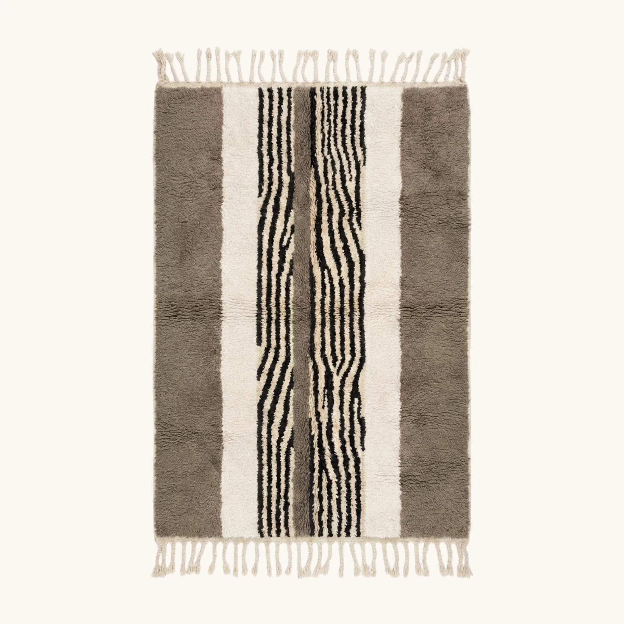 Full view of the Imal taupe, ivory and black Beni Ourain rug with a central stripe design.