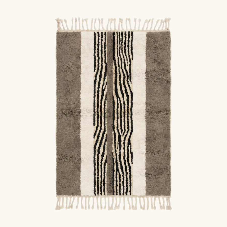 Full view of the Imal taupe, ivory and black Beni Ourain rug with a central stripe design.