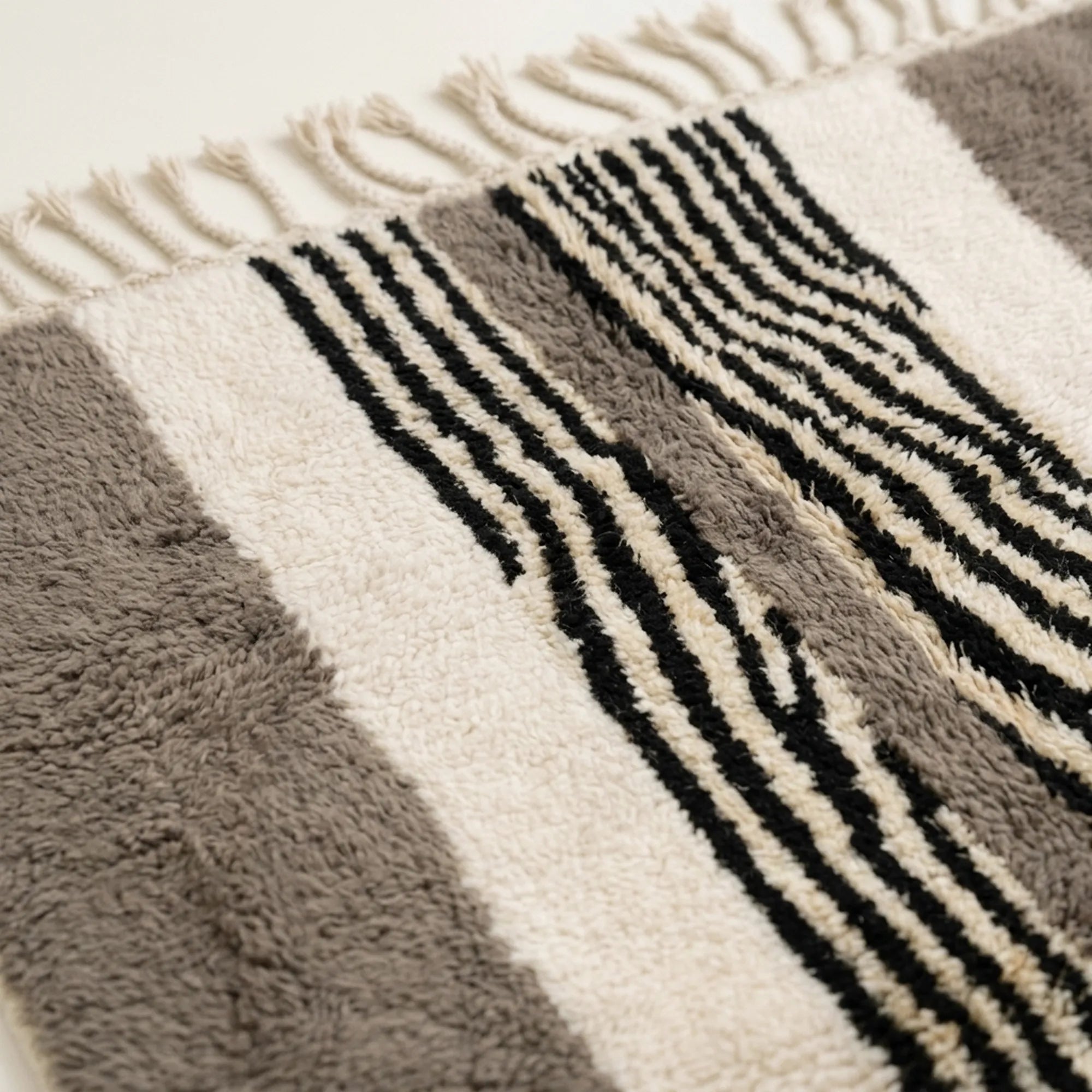 Fringe and edge detail of the Imal hand-knotted rug.