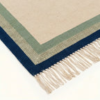 Ivory, sage and navy Zanafi rug Tazalt with layered border design, border and fringe detail