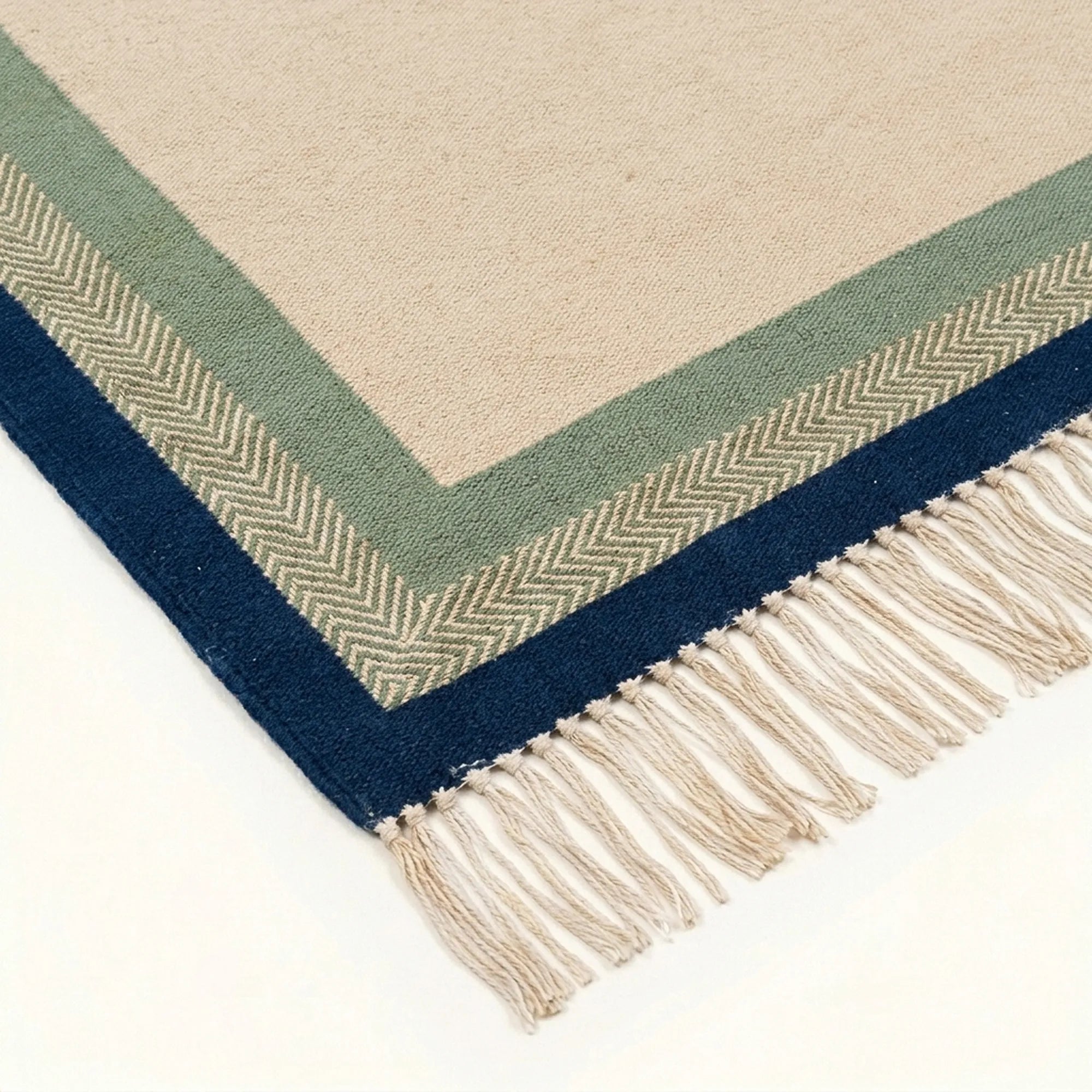 Ivory, sage and navy Zanafi rug Tazalt with layered border design, border and fringe detail