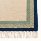 Ivory, sage and navy Zanafi rug Tazalt with layered border design, pattern close-up