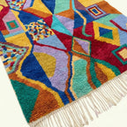 Angled view showing the pattern and wool pile of the Tifawt Boujaad rug.
