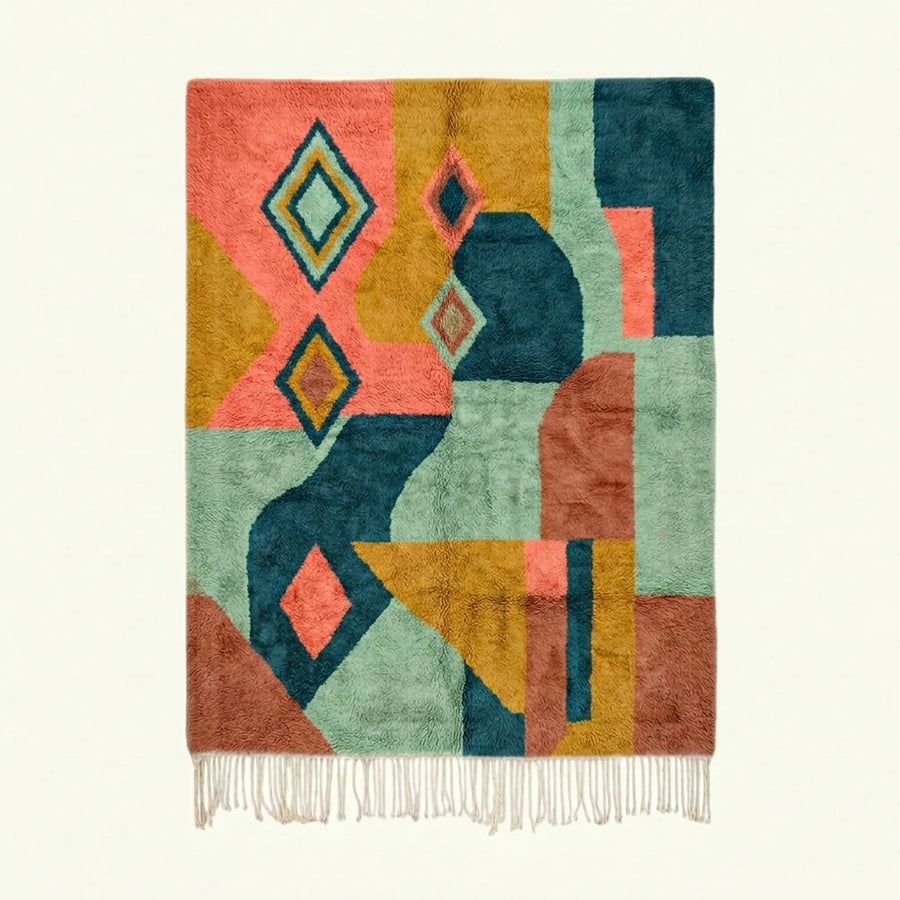 Full view of the Tifawin Boujaad rug in teal, coral, ochre and sage with oversized abstract diamond color blocks