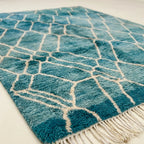 Teal and ivory Mrirt rug Afer organic lattice wool detail