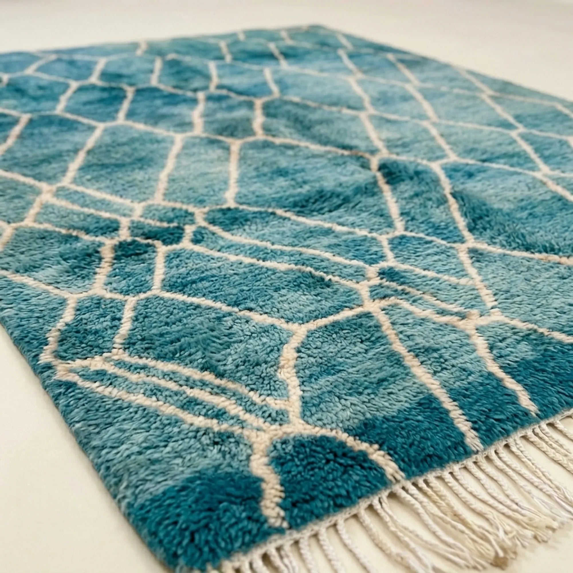 Teal and ivory Mrirt rug Afer organic lattice wool detail