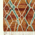 Terracotta and aqua Mrirt rug Amsaw organic lattice wool detail