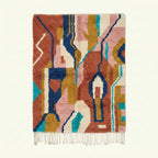 Full view of the Ilyan Boujaad rug in terracotta, blush, teal, navy and ochre with abstract vertical color blocks