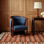 Tiziri terracotta, charcoal and ivory Beni Ourain rug styled in a refined living room.