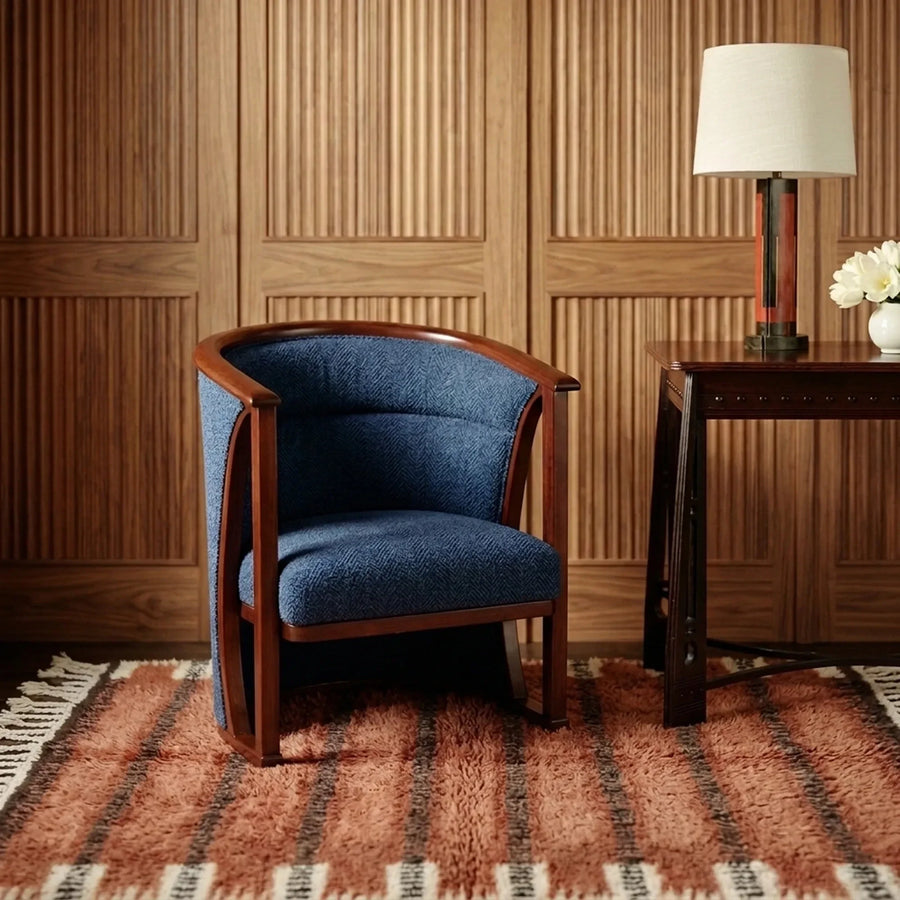 Tiziri terracotta, charcoal and ivory Beni Ourain rug styled in a refined living room.