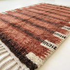 Border detail of the Tiziri horizontal band rug.
