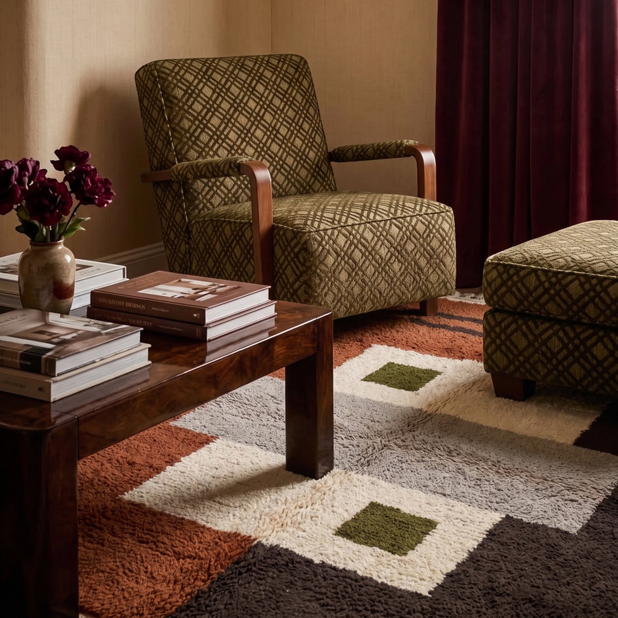 Tawenza Mrirt rug in living room with wooden furniture and patterned armchair