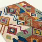 Angled view showing the pattern and wool pile of the Ayyur Boujaad rug.