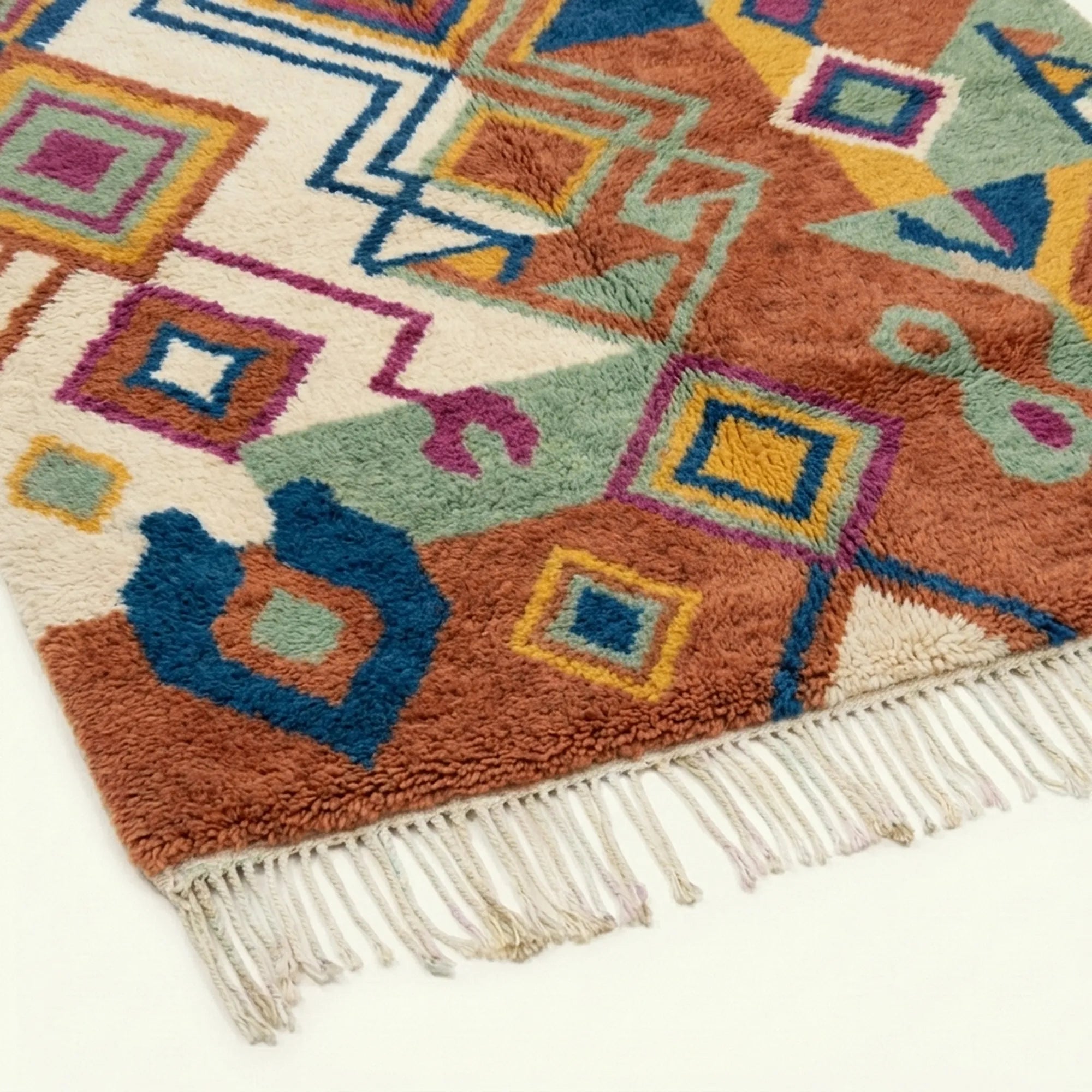 Fringe and edge detail of the Ayyur terracotta Boujaad rug.