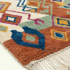 Close-up of the natural wool pile and woven texture of the Ayyur Boujaad rug.