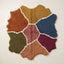 Talwit Azilal rug in terracotta, gold, navy, rose, olive and burgundy with organic colour patches separated by ivory lines, flat lay view