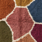 Macro detail of Talwit Azilal rug pile and colour block boundaries with ivory separating lines