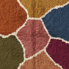 Detailed view of Talwit rug surface showing colour patch transitions and handwoven construction