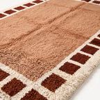 Close-up of Tafat rug pile showing hand-knotted wool texture and thick soft construction