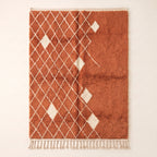Terracotta and ivory Beni Ourain rug with diamond lattice pattern and scattered ivory diamond motifs on plain background