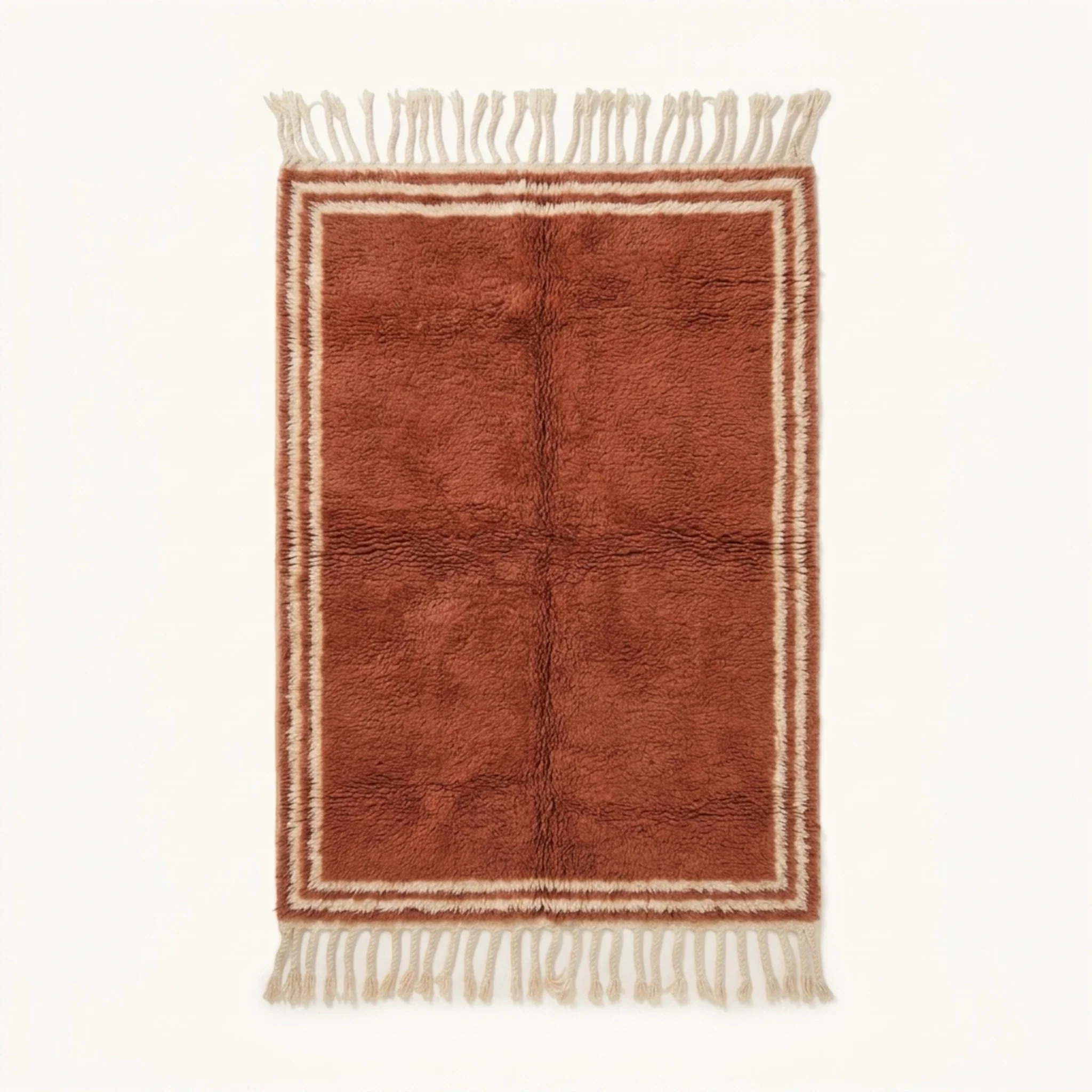Full view of the Tislit terracotta and ivory Beni Ourain rug with a double border design and hand-tied fringe.