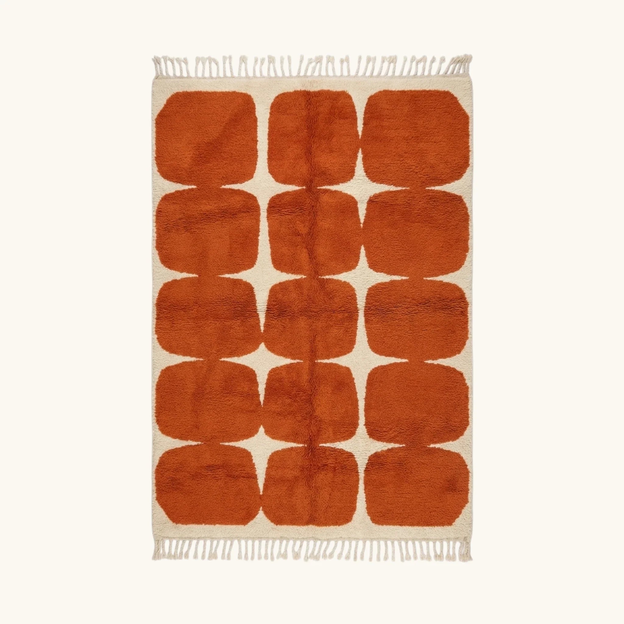 Full view of the Tifawt terracotta and ivory Beni Ourain rug with a rounded grid design.