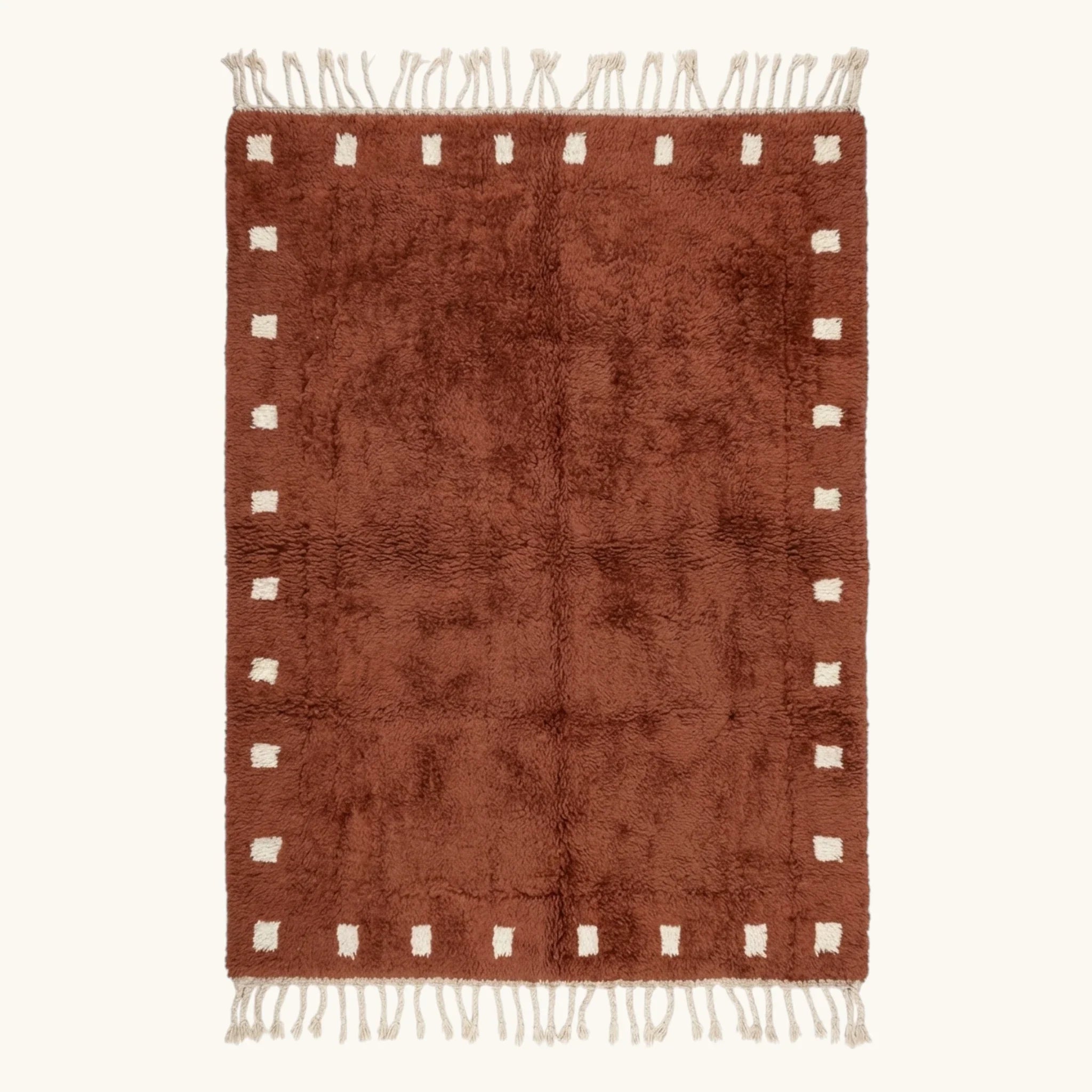 Full view of the Tazrout terracotta and ivory Beni Ourain rug with a square border design.