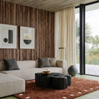 Terracotta and ivory square border Moroccan rug styled in a living room.